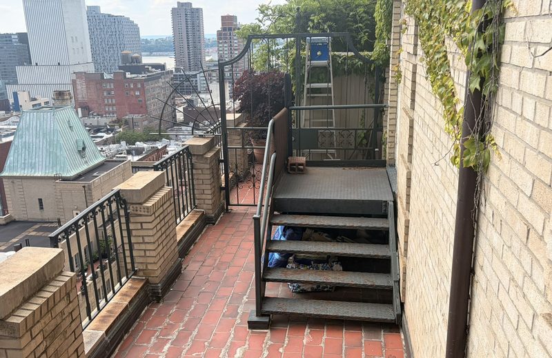 Exterior terrace and service stair at grade