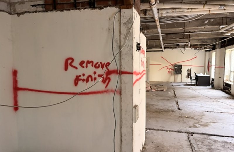 Scope marked directly on the structure during demolition