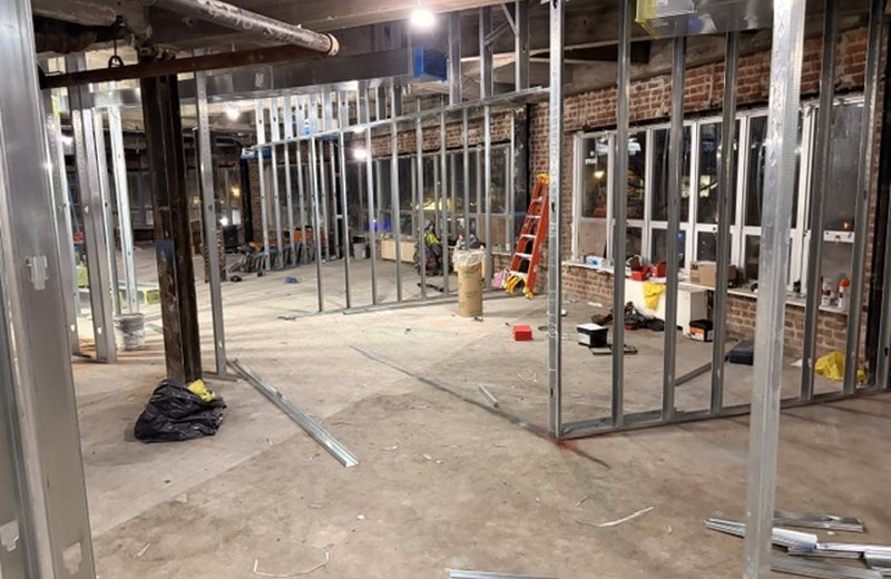 Partition framing across the floor, services above