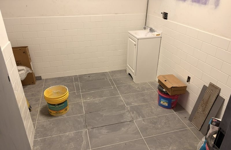 Tiled washroom, fixtures going in