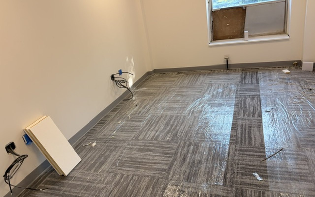 A completed office at Parkchester, carpet laid and daylight in