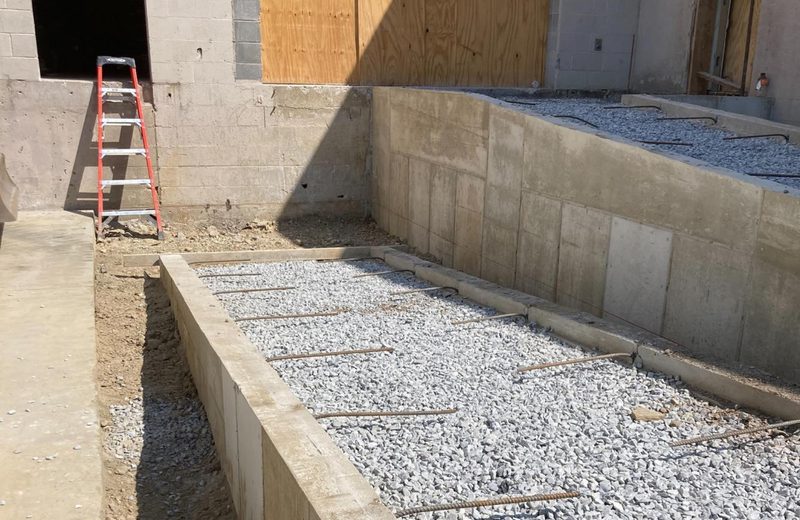 Poured foundation, stripped and backfilled